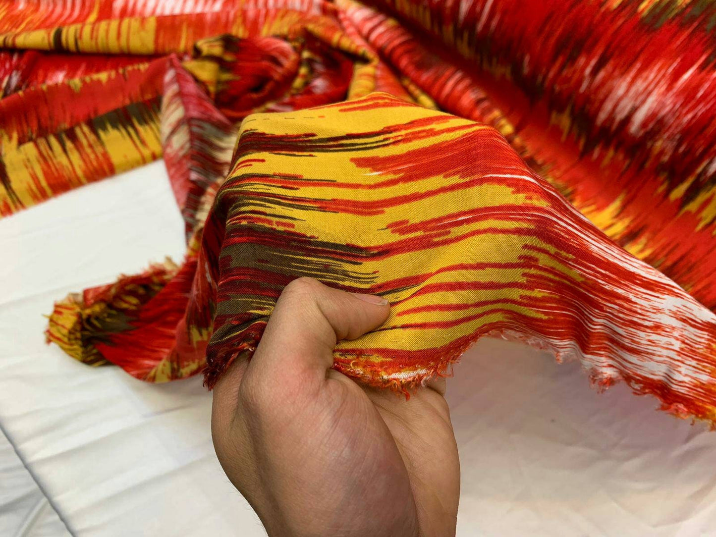 Rayon challis abstract red yellow oranges ad browns organic fabric sold by the yard dress soft flowy multicolor dress draping clothing ikat