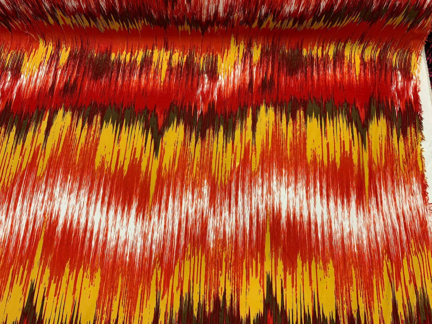 Rayon challis abstract red yellow oranges ad browns organic fabric sold by the yard dress soft flowy multicolor dress draping clothing ikat
