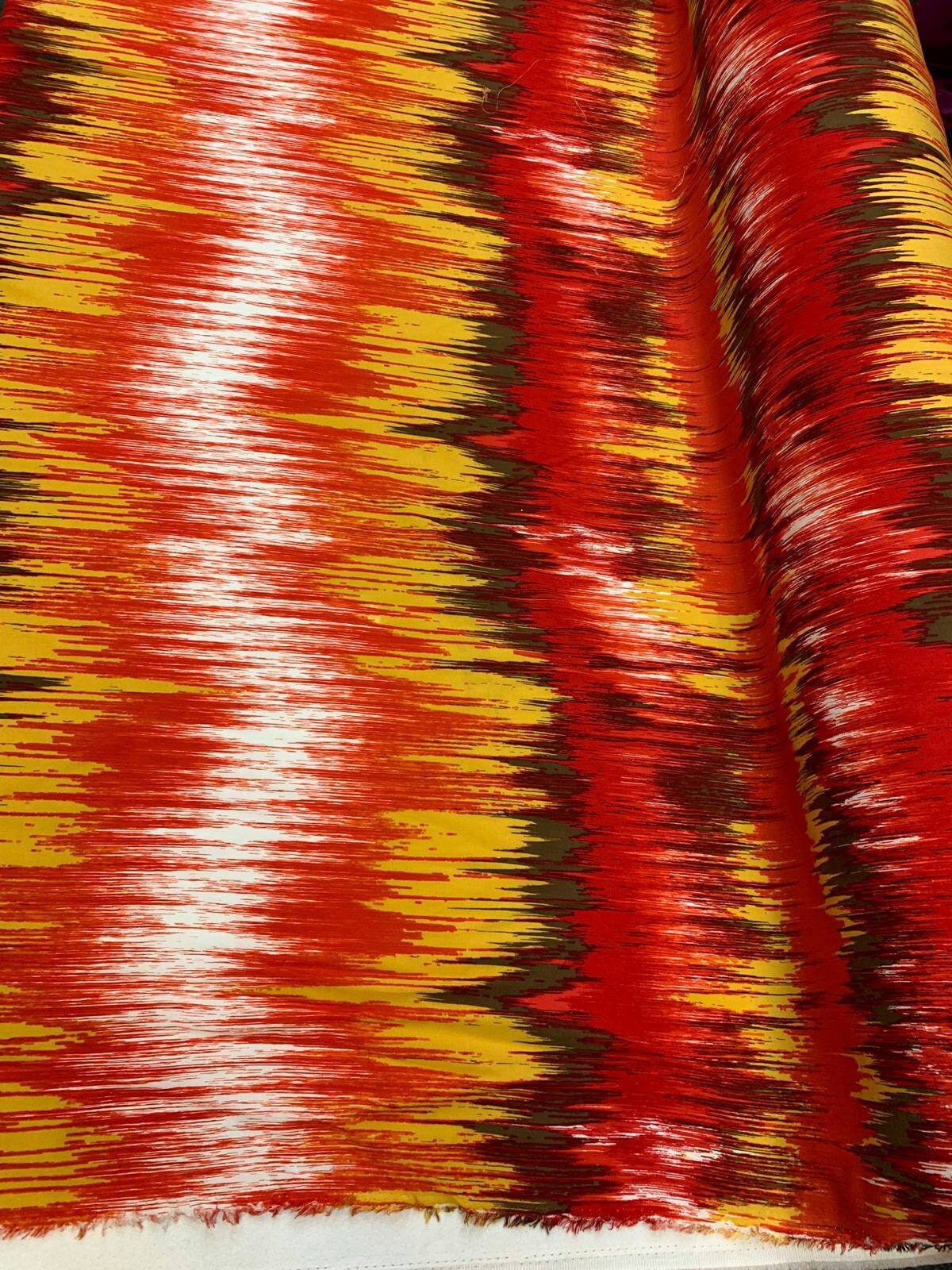 Rayon challis abstract red yellow oranges ad browns organic fabric sold by the yard dress soft flowy multicolor dress draping clothing ikat