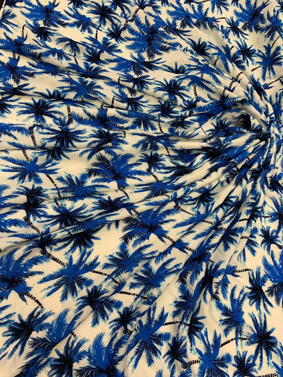 Rayon chally with off white background and blue palmtrees tropical fabric sold by the yard clothing dress decoration organic kids