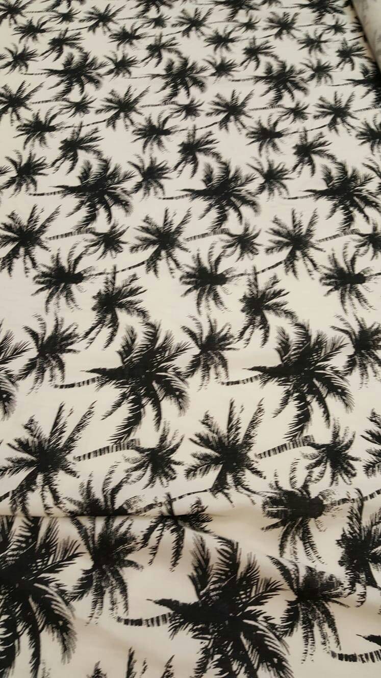 100% Rayon chally with off white background and black palmtrees