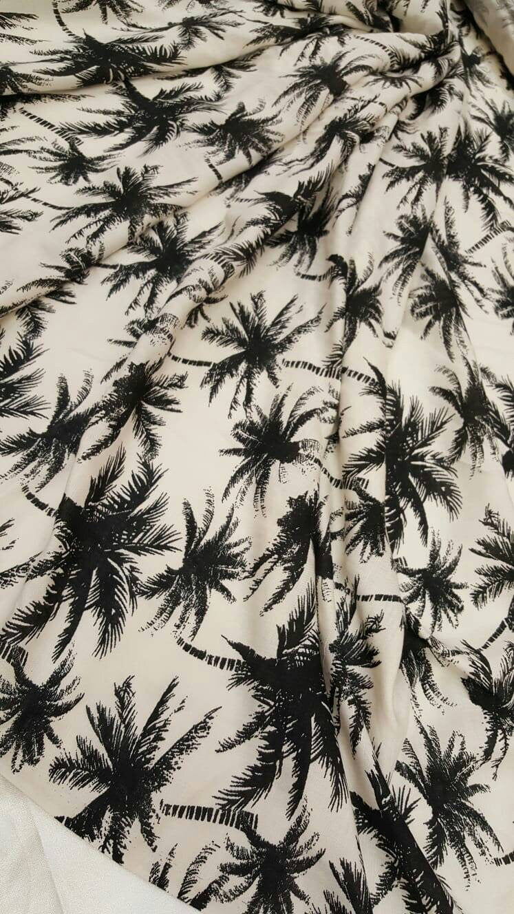 100% Rayon chally with off white background and black palmtrees
