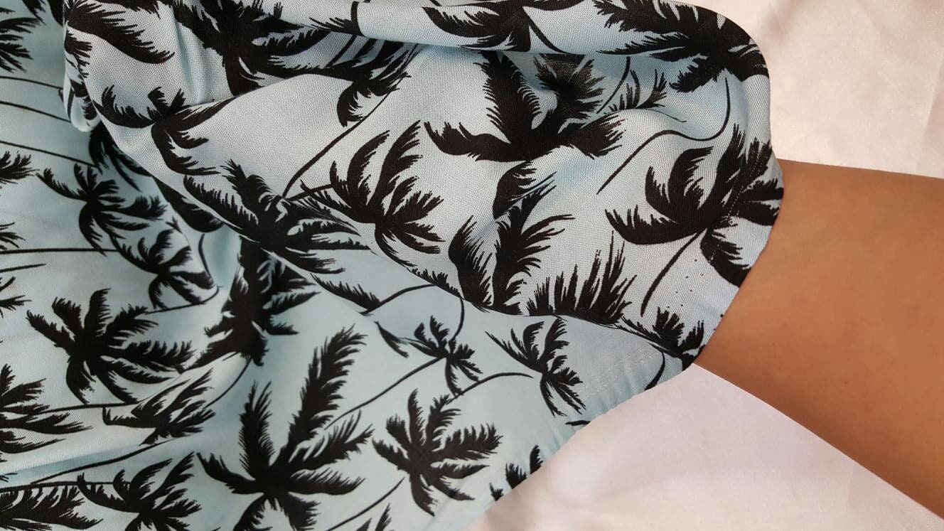 100% Rayon challis black Palm tree on baby blue background