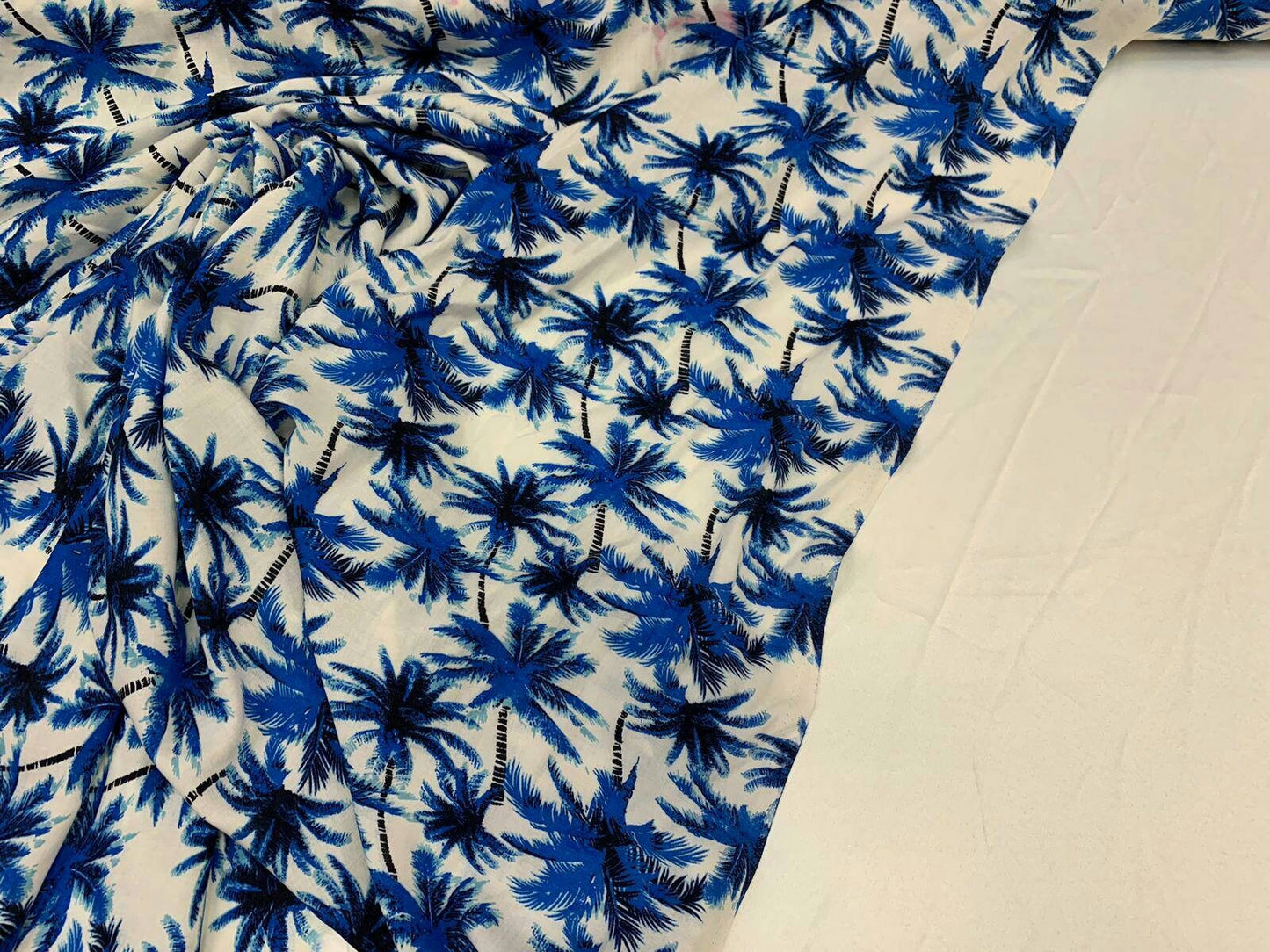 Rayon chally with off white background and blue palmtrees tropical fabric sold by the yard clothing dress decoration organic kids