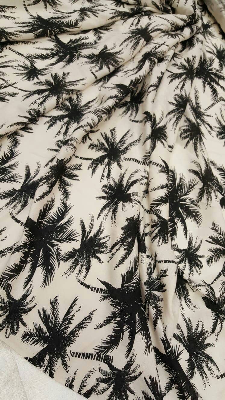 100% Rayon chally with off white background and black palmtrees