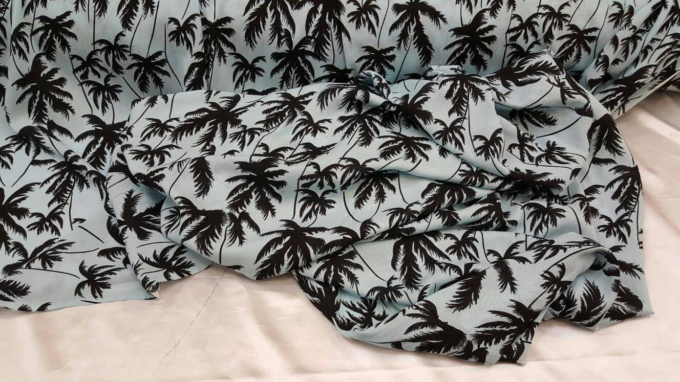 100% Rayon challis black Palm tree on baby blue background
