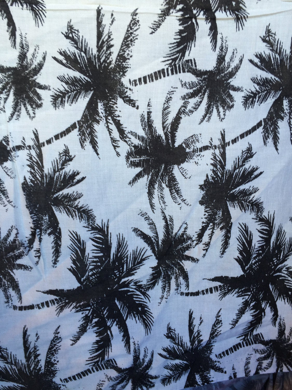 100% Rayon chally with off white background and black palmtrees