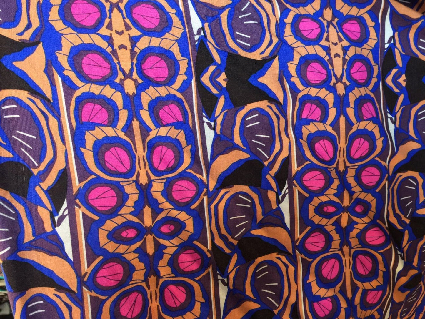 100% Rayon. Tropical Inspired Print with Hues of Fuchsia, Blue, Brown and Black Hues. 58-60 Inches Wide Sold by the Yard