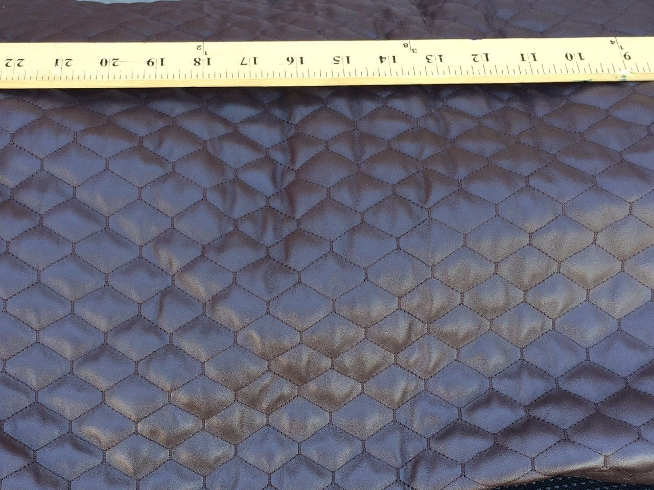 58 inches w. Mercedes Benz chocolate upholstery fabric. Cotton backing