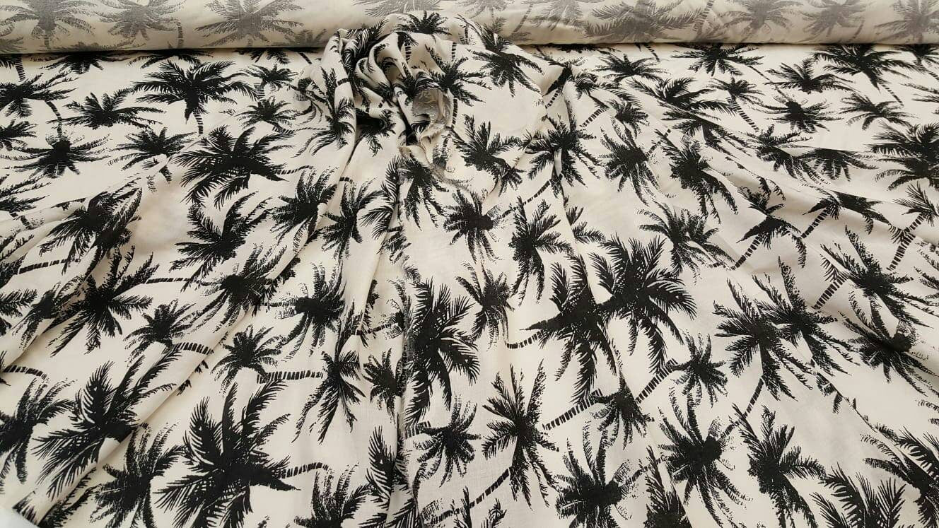100% Rayon chally with off white background and black palmtrees