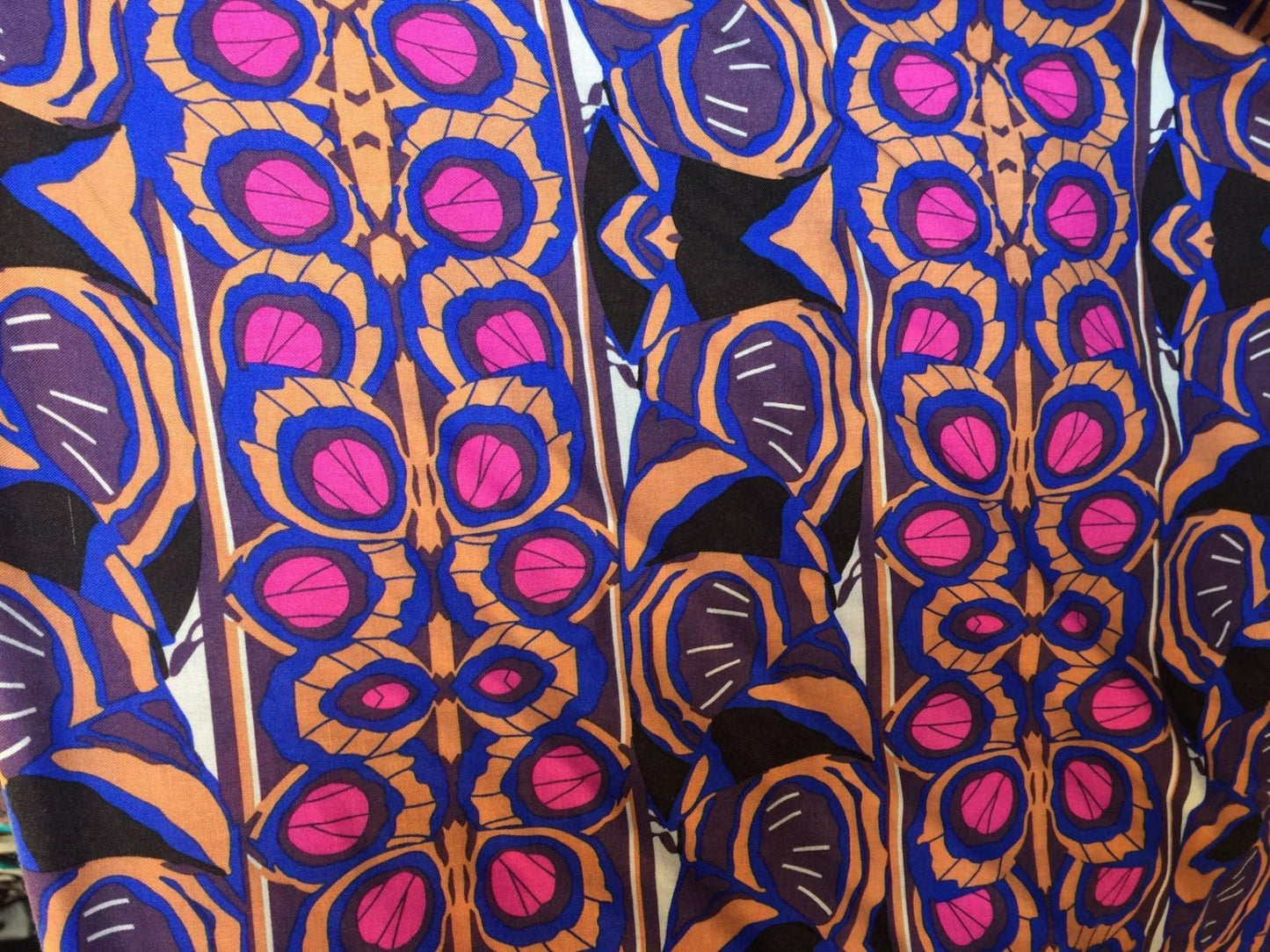 100% Rayon. Tropical Inspired Print with Hues of Fuchsia, Blue, Brown and Black Hues. 58-60 Inches Wide Sold by the Yard