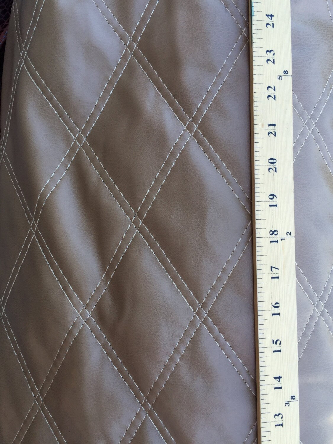 Brown vinyl Bentley upholstery  Cotton backing. Fabric sold by the yard 58 inch w